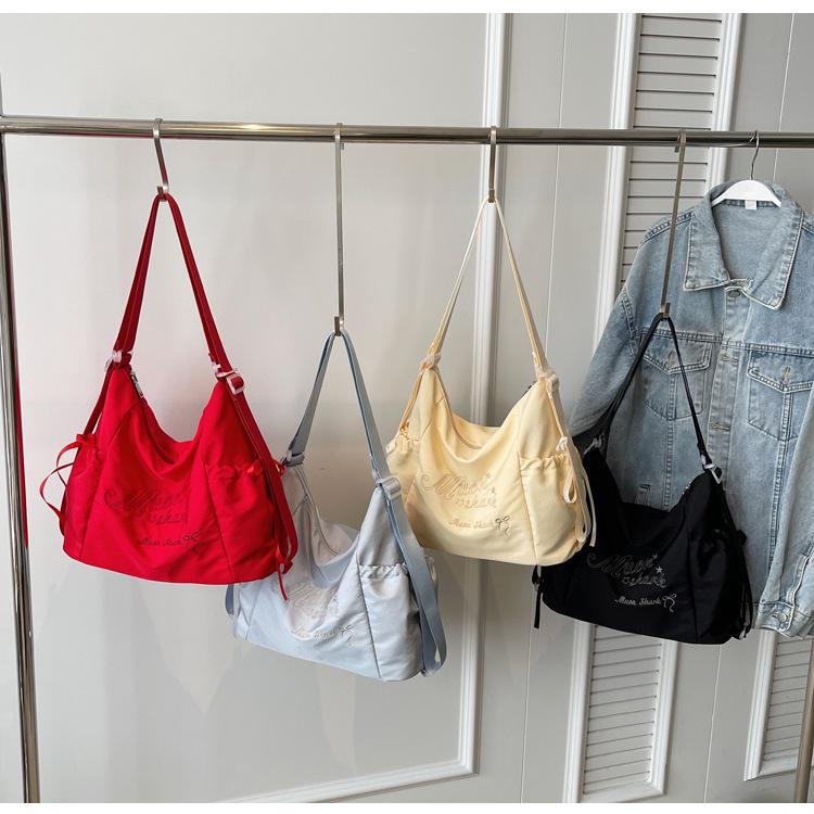 Tote bag women's 2024 new large-capacity commuting letter foreign feeling college students commute to class shoulder backpack