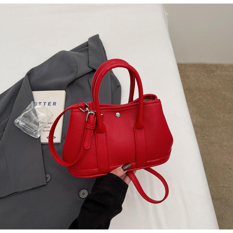2025 New Niche Simple Leisure Commuter Portable Bucket Bag Versatile Solid Color Child and Mother Bag Messenger Bag Bag