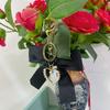 Elegant Pearl Strand Bow Keychain with Heart Charm, Octagonal Shape, Floating Fun-Themed Accessory, with Split Ring Closure for Handbags and Car Keys