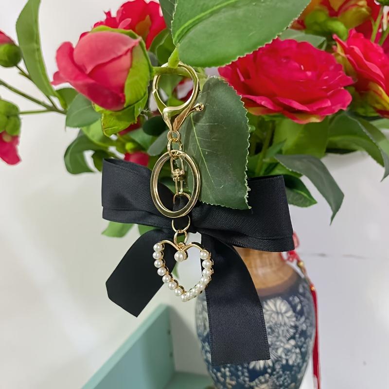 Elegant Pearl Strand Bow Keychain with Heart Charm, Octagonal Shape, Floating Fun-Themed Accessory, with Split Ring Closure for Handbags and Car Keys
