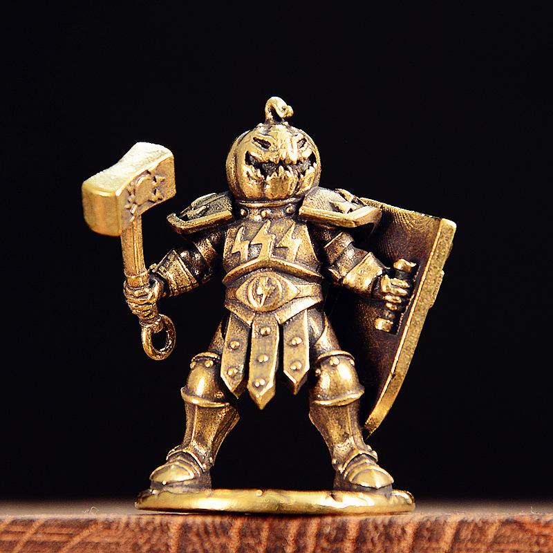 

Brass Pumpkin Head Knight Figurine - Miniature Warrior Statue with Hammer and Shield for Desk Decor медный
