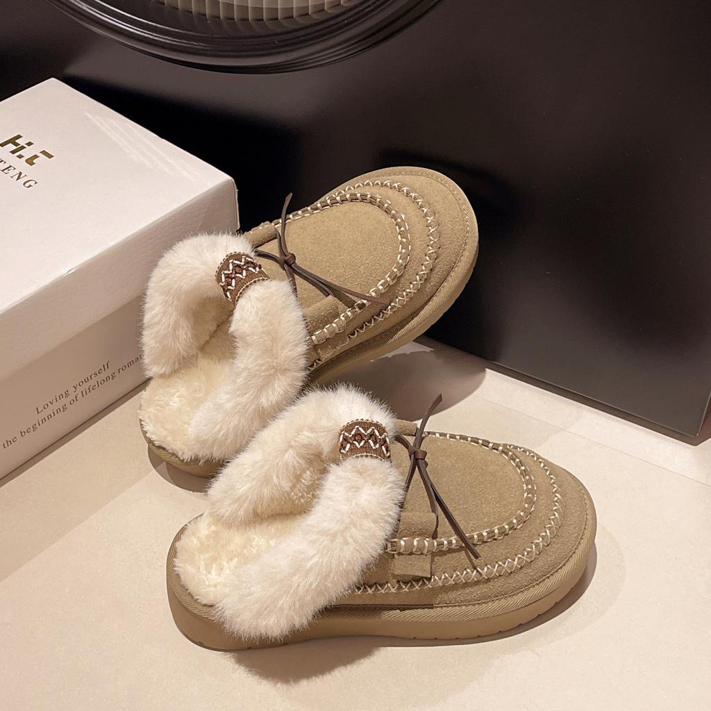 In the winter of 2024 thick-soled wool snow boots for women are heightened and thickened to keep warm and half-towed hairy slippers for women
