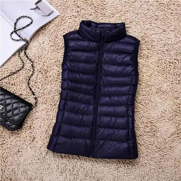 

Women Winter Fashionable Outerwear Warm Vests Light Down Women Waistcoat Portable Warm Sleeveless Liner Casual Vests 8XL темно-синього кольору