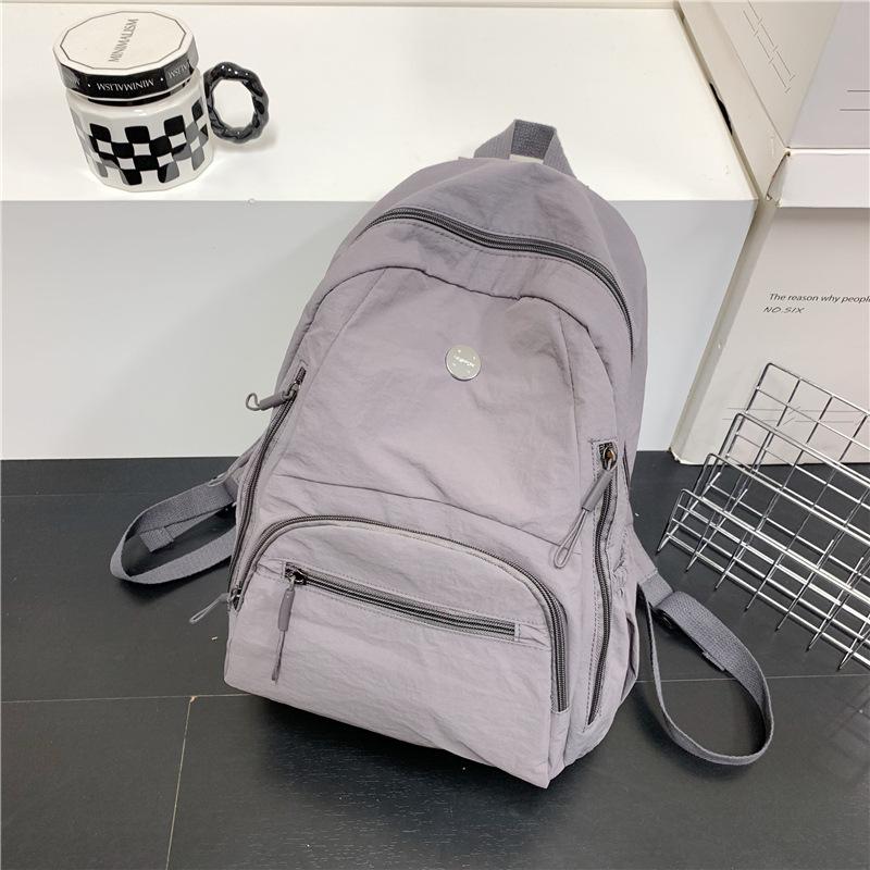 The Backpack Is Lightweight, Casual, and Has A Large Capacity. It Is A Simple and Fashionable Student Schoolbag