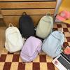 Casual solid color large-capacity schoolbag 2025 new versatile junior high school backpack college student travel backpack tide