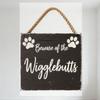 Rustic Wooden Sign with Black Base & White Distressed Paint, Paw Prints, 'Beware of the Wigglebutts' Text, Natural Rope Hanger F