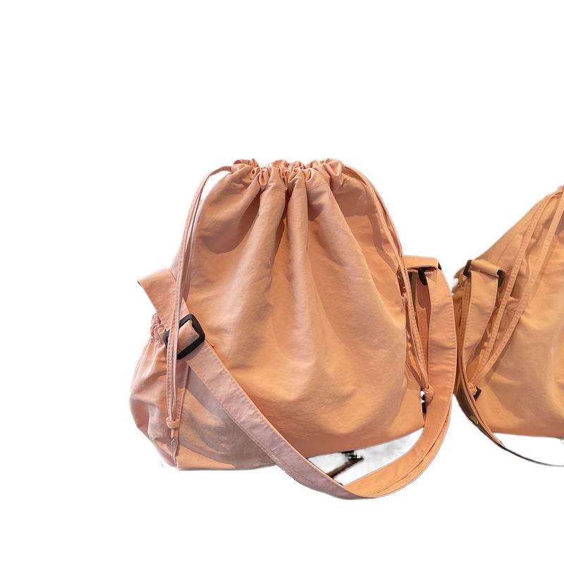 2025 Black Pleated Drawstring Tote - Large Capacity, Versatile Single-Shoulder Crossbody Bag for Casual and Commute Use.