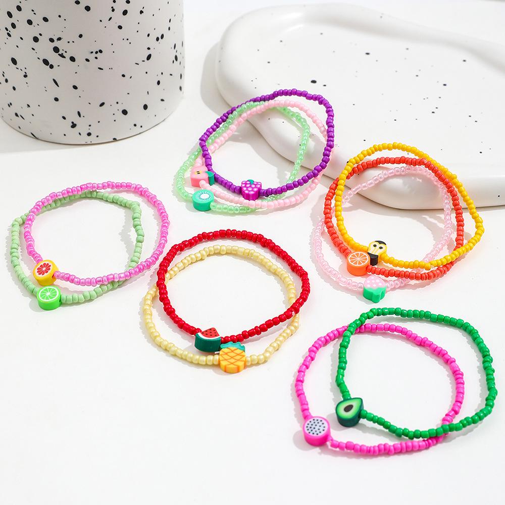 12-Piece Bohemian Rainbow Clay Fruit Bracelet Set: Strawberry, Watermelon, Grapefruit