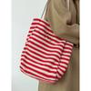 Large capacity striped canvas bag women's 2025 new niche embroidery lazy wind commuter portable shoulder tote bag