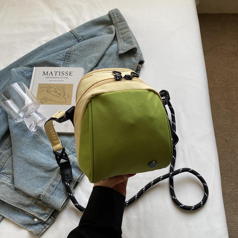 

Japanese casual niche design, simple and foreign, personality, portable small satchel, fashion travel, fashion small round bag girl