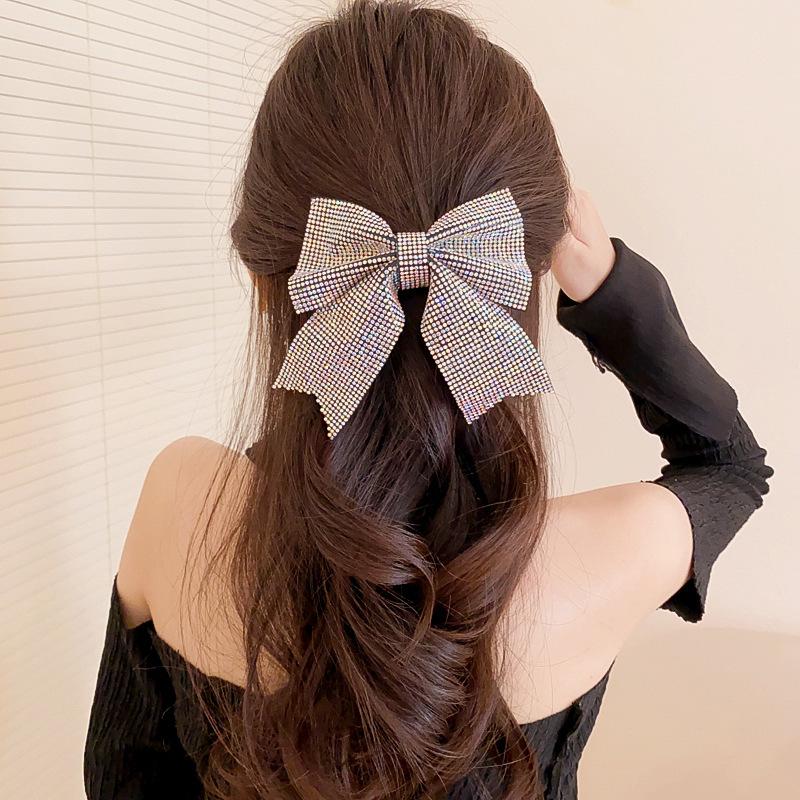 Korean version of fashion bow hairpin niche simple and versatile temperament spring clip advanced semi-drape hairpin