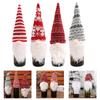 Four Wine Bottle Covers with Whimsical Gnome Design for Holiday Tables Suitable for Christmas New Year and Festive Events