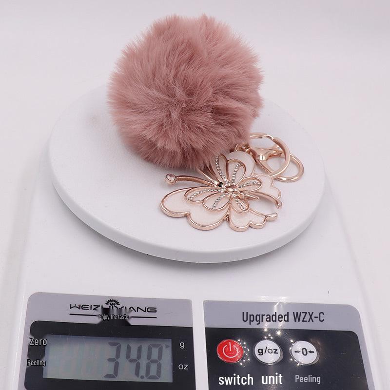 Exquisite Butterfly Plush Fur Ball Keychain for Bags, Cars, and Luggage.