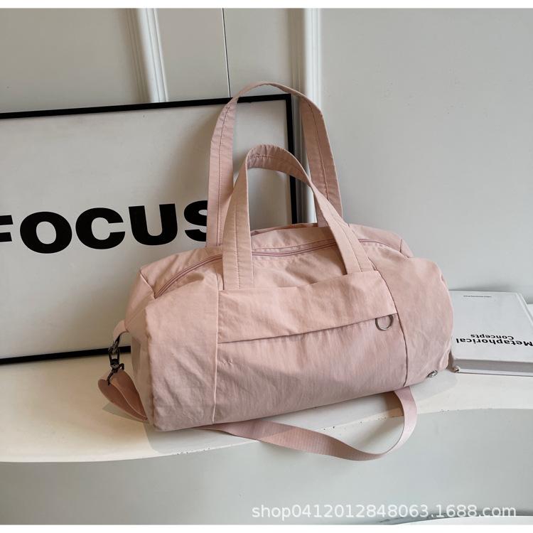 

2025 new casual portable fitness bag large capacity short trip bag light shoulder bag messenger bag canvas bag розовый