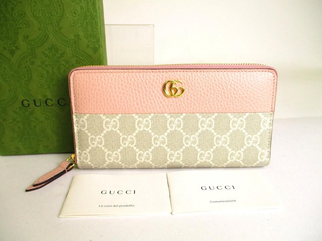 

Автентичний круглий шкіряний гаманець GUCCI Double G з бежевим покриттям і світло-рожевою круглою блискавкою №a217 відремонтований