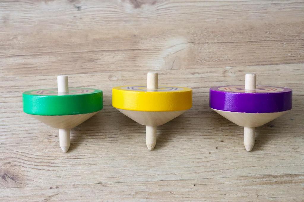 Traditional wooden colored throwing set of 3 toy, tops, (green, yellow, purple)