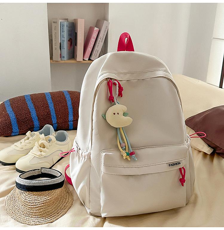 Schoolbag Korean version ins Solid color simple schoolbag Lazy wind backpack Female junior and high school students lightweight large-capacity 