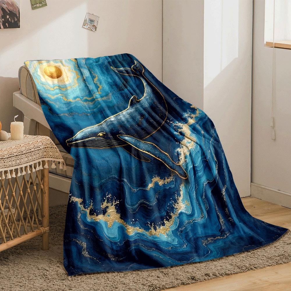 A golden-accented whale swimming in swirling blue waves under a gold sun. for all seasons blanket lunch break throw gift