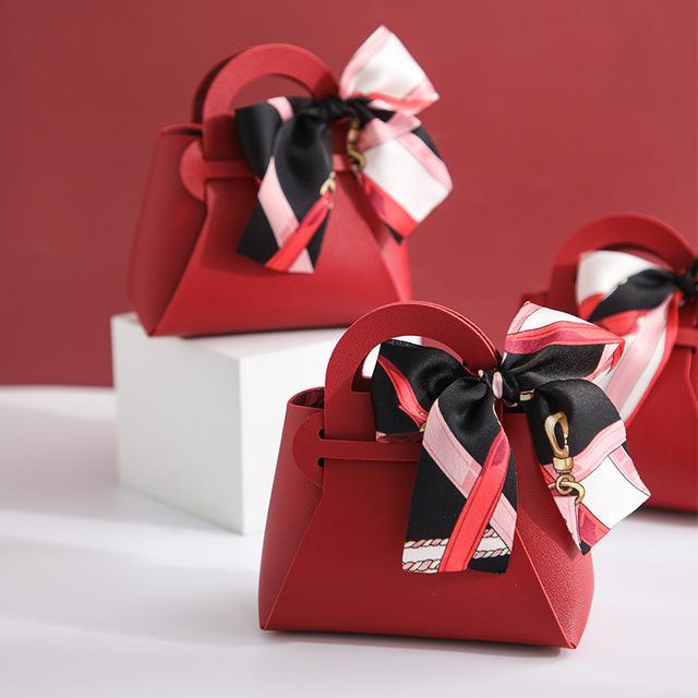 10 pezzi distribuiscono sacchetti regalo in pelle rosa, bomboniere per ospiti, mini borsetta con nastro, scatola per imballaggio di caramelle, decorazioni per feste