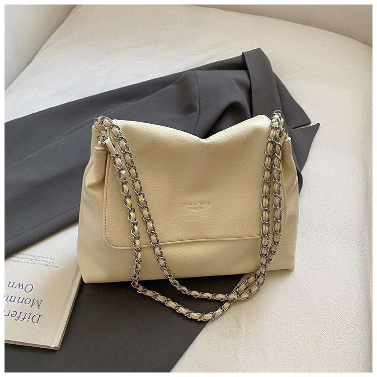 

Big bag women s 2025 new retro soft leather chain shoulder messenger bag casual niche Korean version commuter tote bag белый