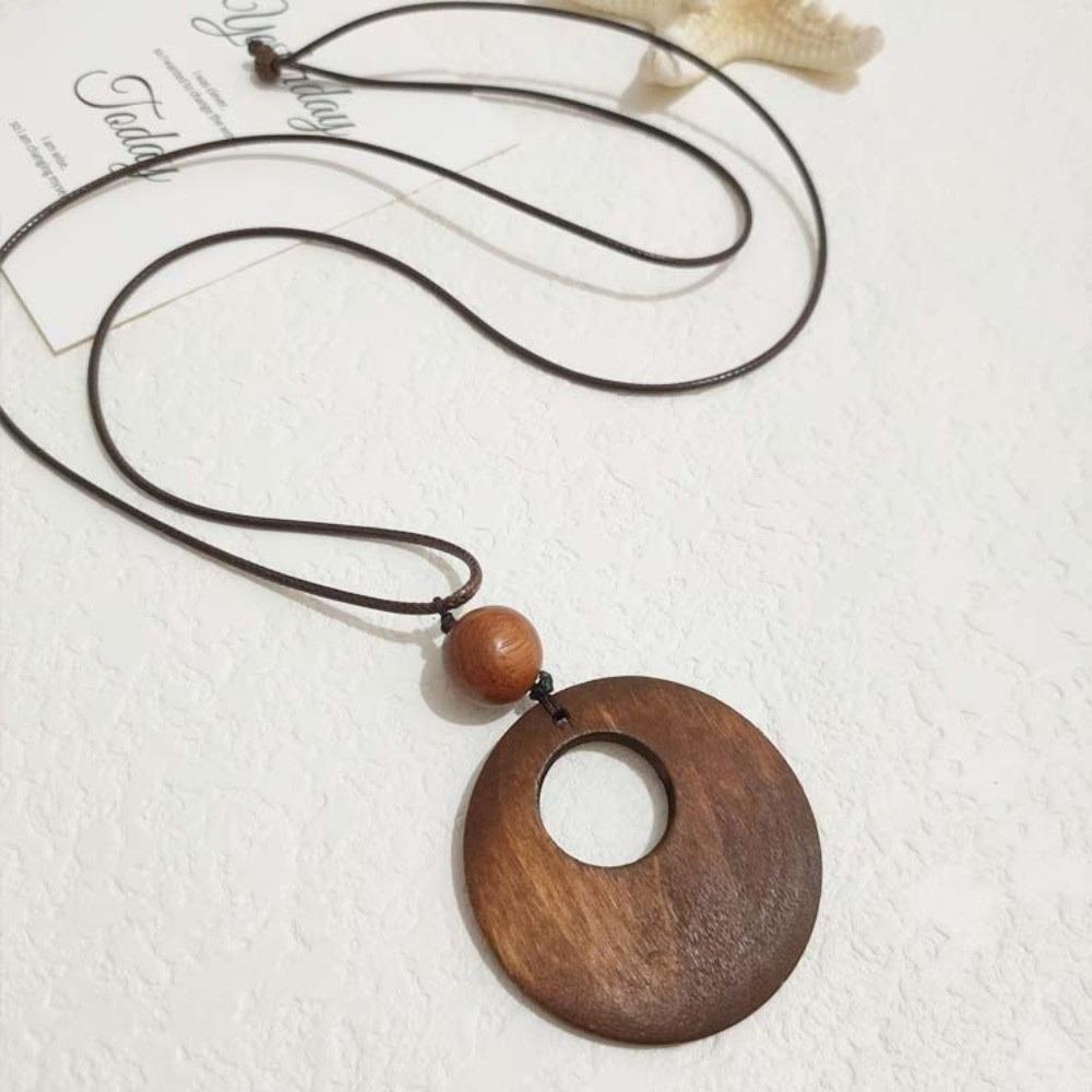 

Hollow Leaves Wooden Pendant Necklace Leather Chain Clothing Pendant Sweater Chain for Women Men 1