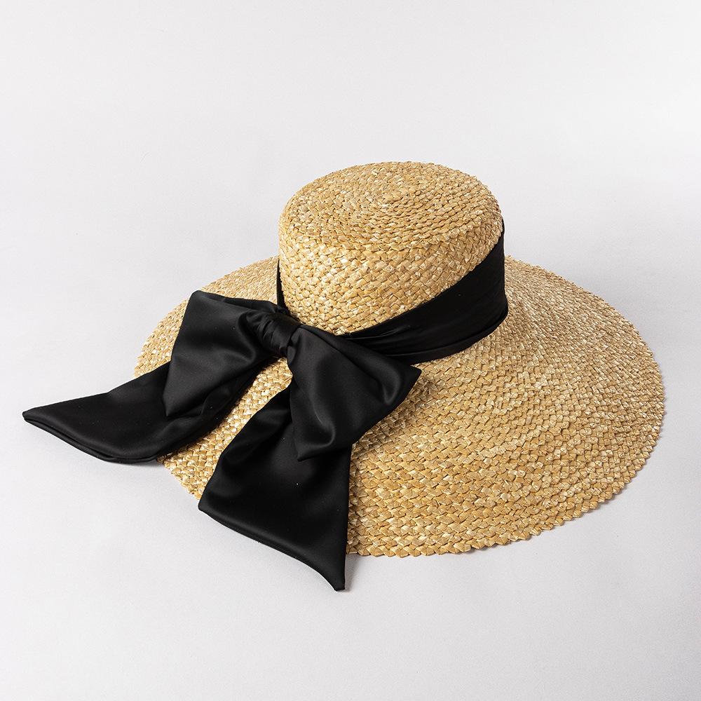 High-quality Hand-knitted Petal Wheat Straw Flat Top Large Eaves Basin Hat Women's Fashion Big Bow Beach Sun Shade Straw Hat