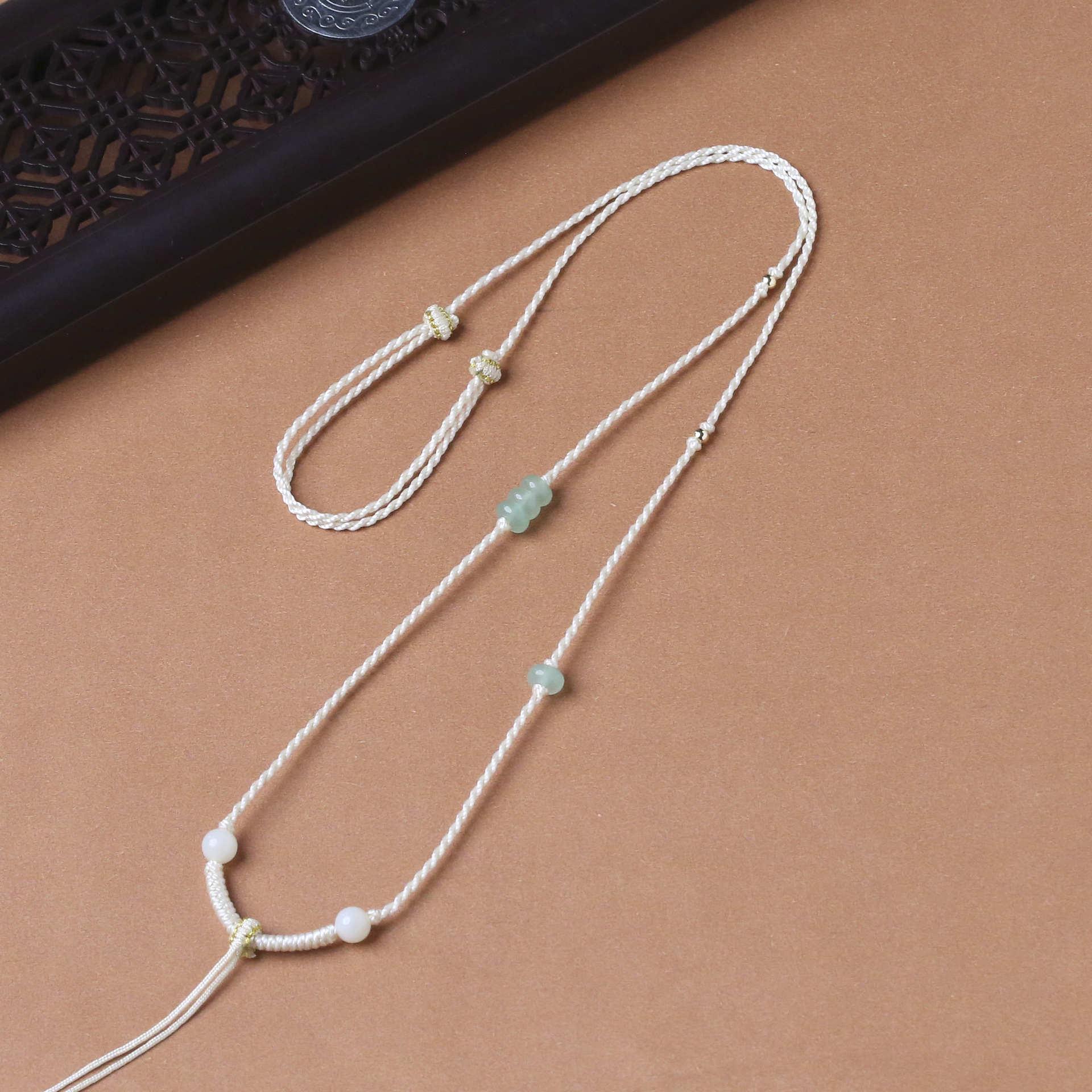 

Плетеное вручную ожерелье-подвеска из нефрита с позолотой