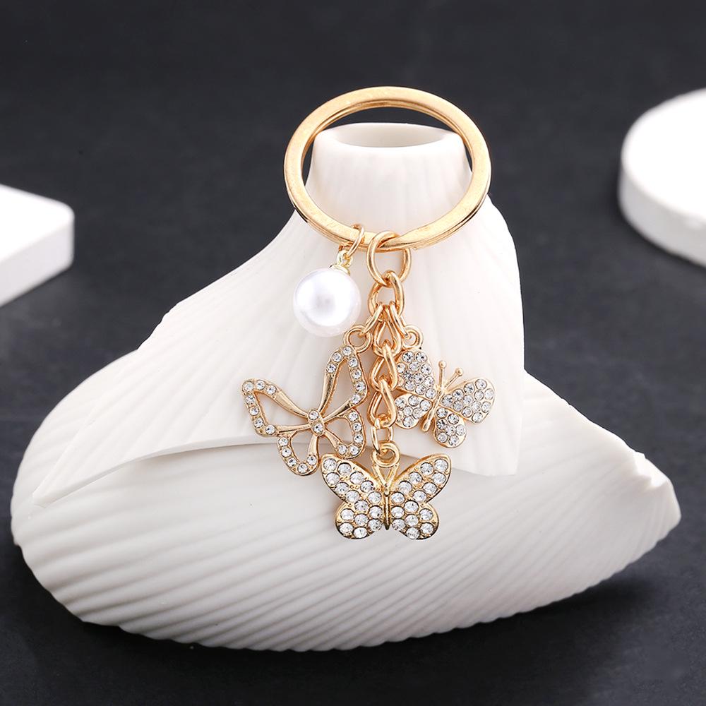 

Полый брелок-подвеска в виде бабочки со стразами и жемчугом