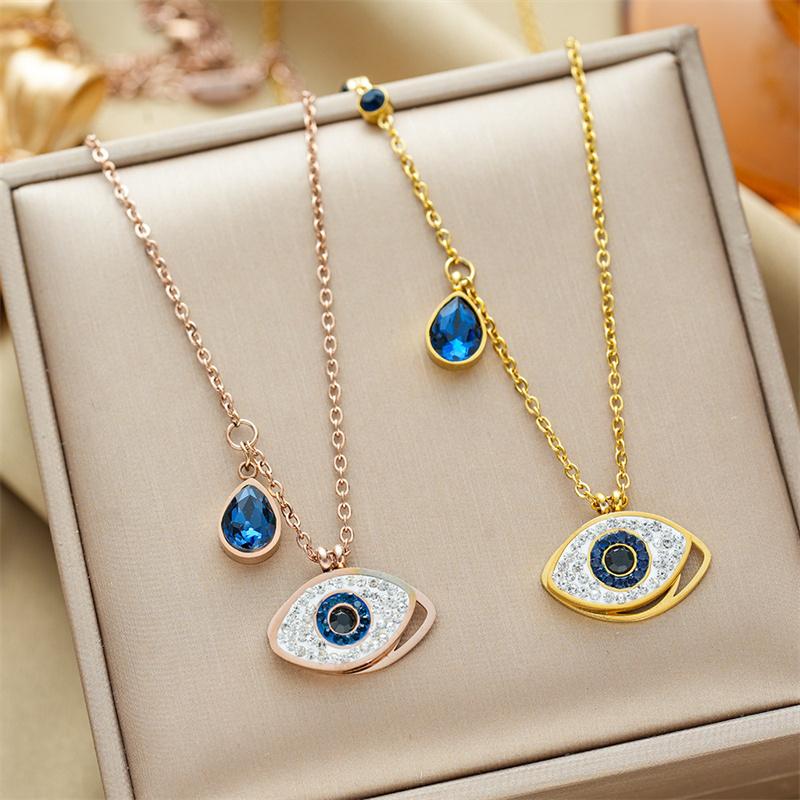 Goldene 316L Edelstahl Nazar-Anhänger Halskette mit blauen Edelsteinen und funkelnden Zirkonia für Damen