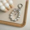 Korean Style Keychain Pendant: Metal Irregular Bow with Pearl Beads for Phone or Bag Accessories
