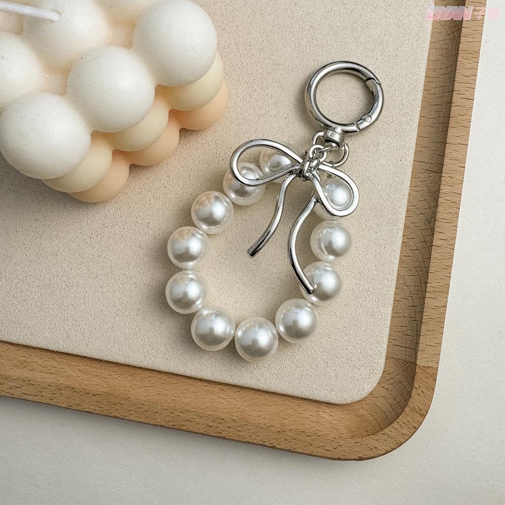 Korean Style Keychain Pendant: Metal Irregular Bow with Pearl Beads for Phone or Bag Accessories
