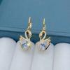1 Pair of Luxurious Golden-Tone Swan Dangle Earrings with Sparkling Rhinestones - Elegant Zinc Alloy Fashion Jewelry for Women