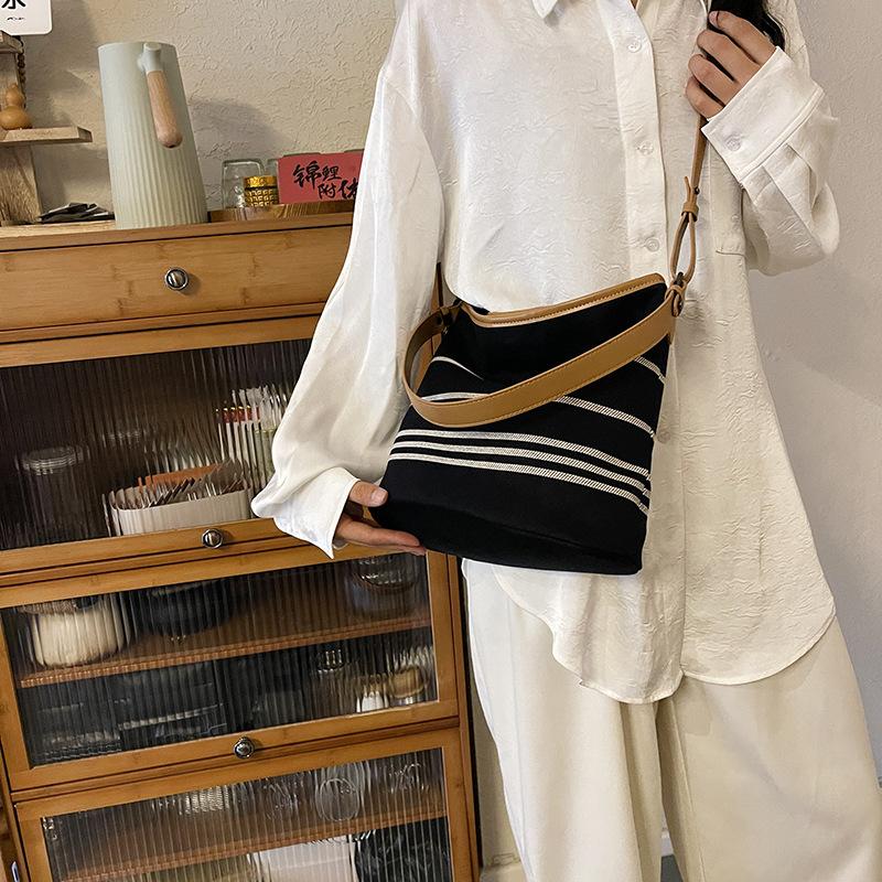 New fashion niche contrasting color striped bucket bag single shoulder oblique span trendy women's bag