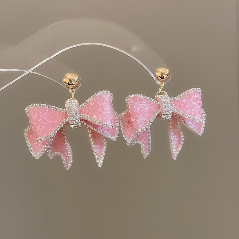 Boucles d'oreilles bohèmes roses à fleurs de perles de rocaille et pompons de perles