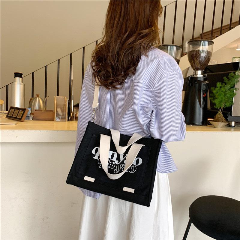 Tote bag niche new portable shoulder bag lazy women large capacity lightweight new versatile casual canvas backpack