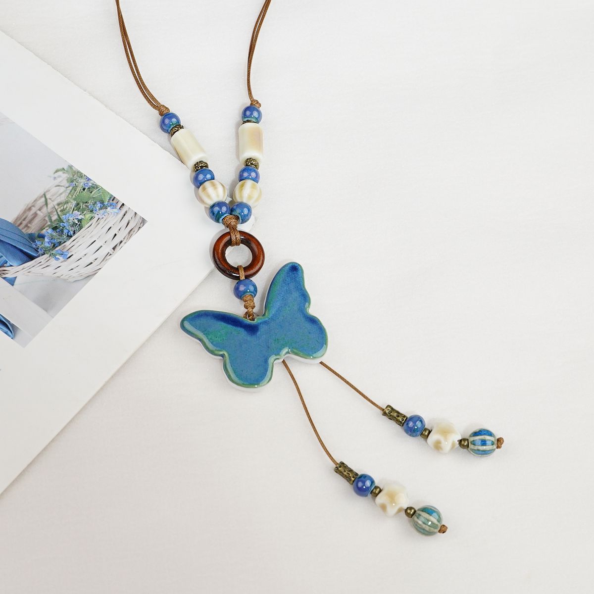 

Ceramic butterfly woven rope pendant necklace ethnic style sweater chain niche design versatile item decoration