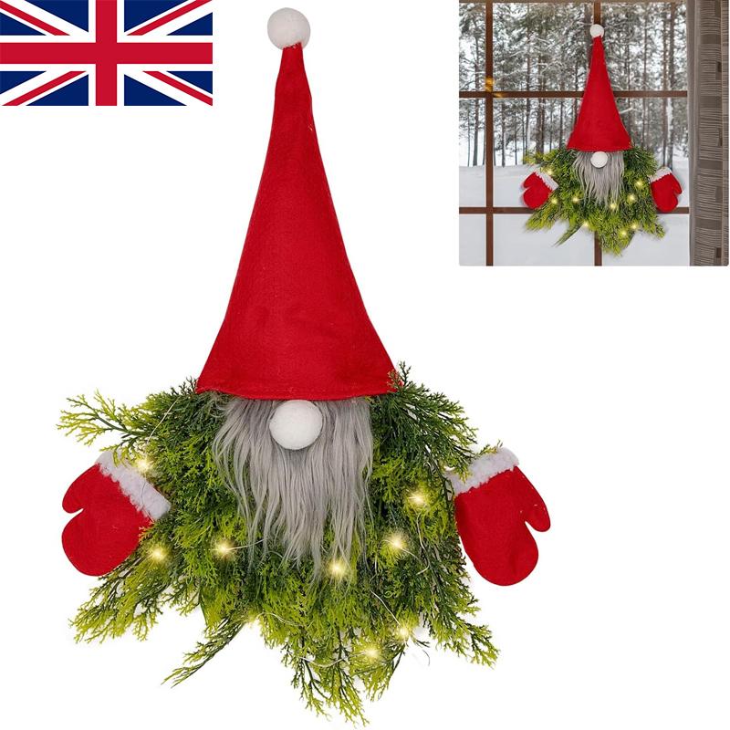 

Большой рождественский венок с огнями Санта-Гонк-гном висит рождественское украшение