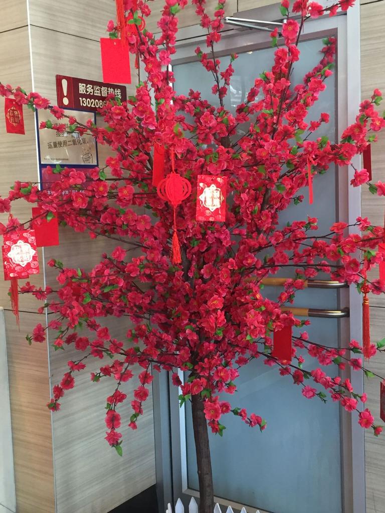 Manufacturers supply artificial peach blossom branches plum blossom branches fake peach blossom branches wedding decoration living room plastic flowe