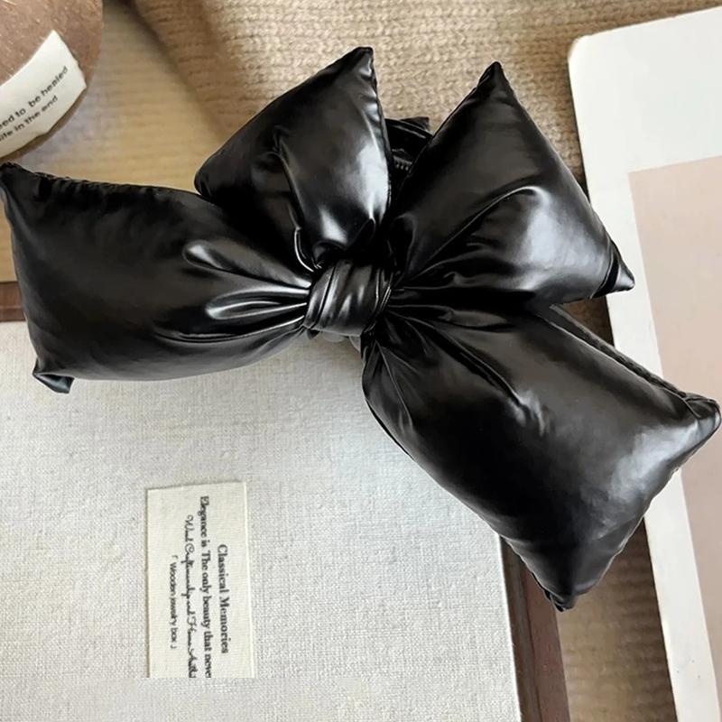 A Girl with a Large Black Bow Clip, a Thick Hair Clip with a Big Chin, and a Fashionable Anti-slip Winter Hair Accessory