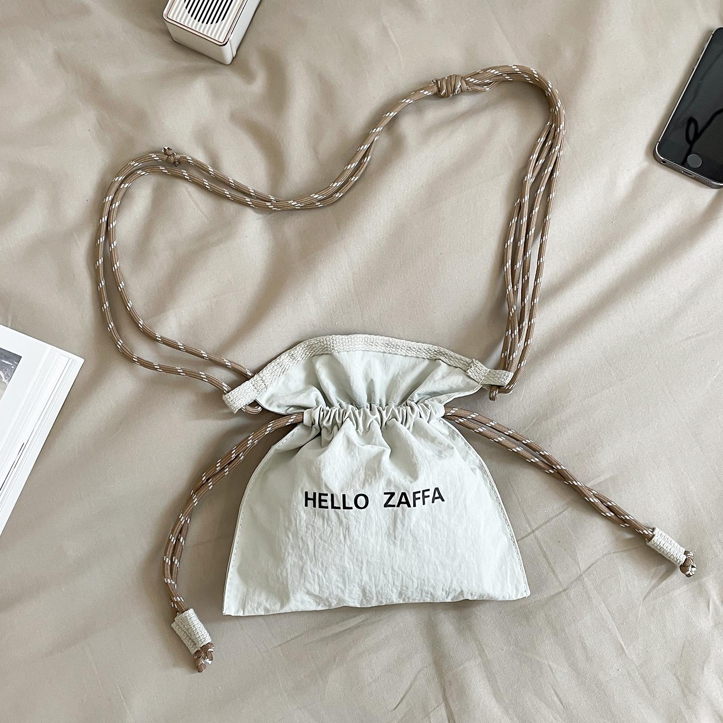

Small bag for mobile phones in summer, women s niche, light and versatile, drawstring, drawstring, mouth bucket, crossbody bag белый