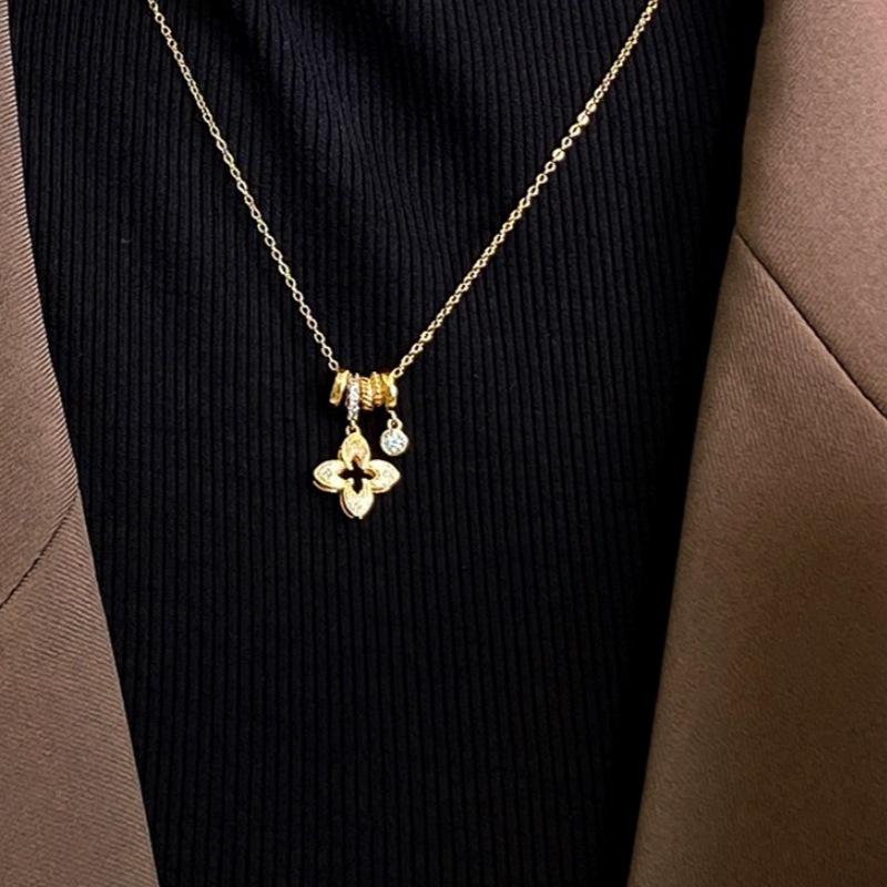 Exquisite Zirconia Flower Pendant Necklace with Round Ring and Sweater Chain - Light Luxury Petal Collarbone Accessory.