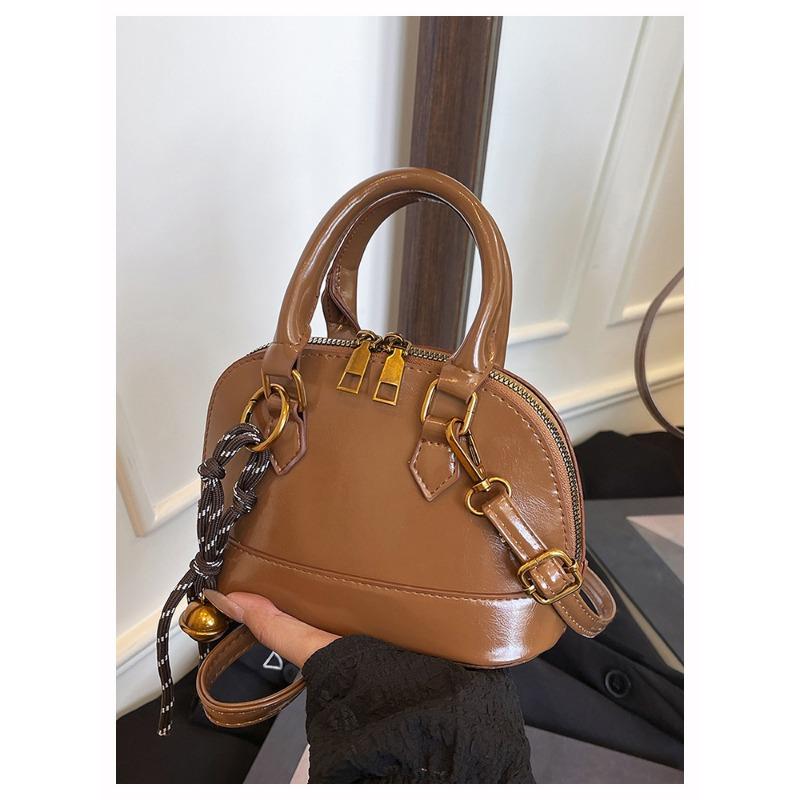 Die Handtasche ist modisch und retro, die Umhängetasche ist stilvoll und die Crossbody-Muscheltasche ist stilvoll