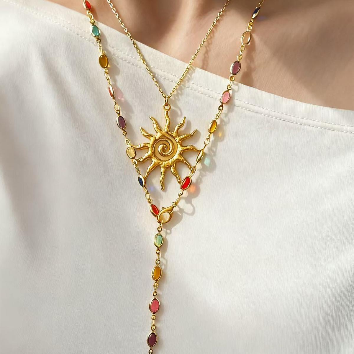 

European and American sun pendant necklace light luxury high sense tassel eye long chain color cold wind collarbone chain