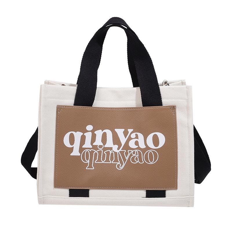 

Tote bag niche new portable shoulder bag lazy women large capacity lightweight new versatile casual canvas backpack хакі