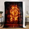 A Fiery Manchester United Logo Emerges Against Smoke and a Dark Background. for All Seasons Blanket Lunch Break Throw Gift