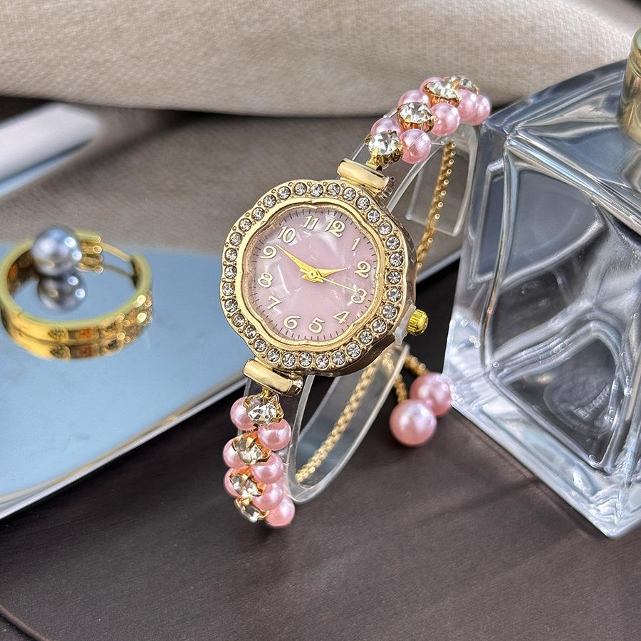 

Жемчужные часы с циферблатом «Подсолнух», полностью инкрустированным бриллиантами, компактным ремешком и двойным рядом жемчуга, выдвижная цифровая поверхность розовый