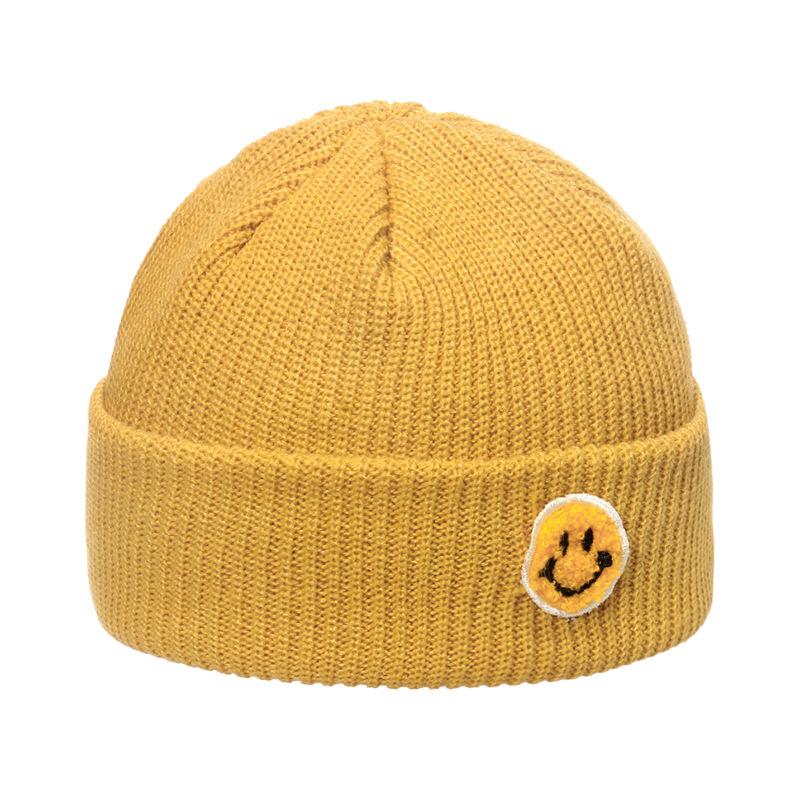 Autumn and winter wool hat male trend Japanese and Korean yuppie knitted warm smiley face sticker landlord hat candy color melon fur hat female