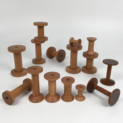 Retro Solid Wood Spool: Nostalgic Handmade Thread Organizer for Cross-Stitch and Crafting.