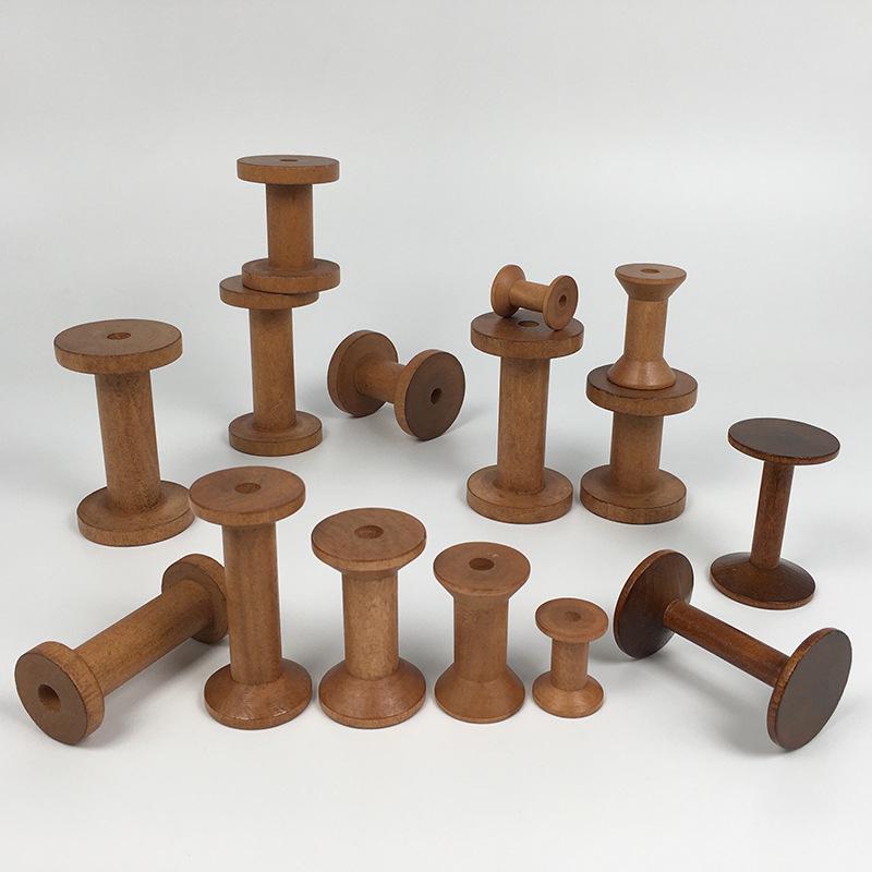 Retro Solid Wood Spool: Nostalgic Handmade Thread Organizer for Cross-Stitch and Crafting.
