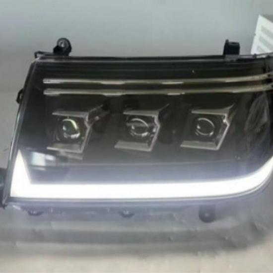 Compatible with Toyota Land Cruiser LC100 1998-2007 Headlight Assembly with LED Daytime Running Lights and Turn Signals.